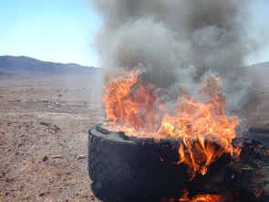 The sun alone appeared to have ignited this discarded truck tyre! Intense heat in the already baking Atacama.